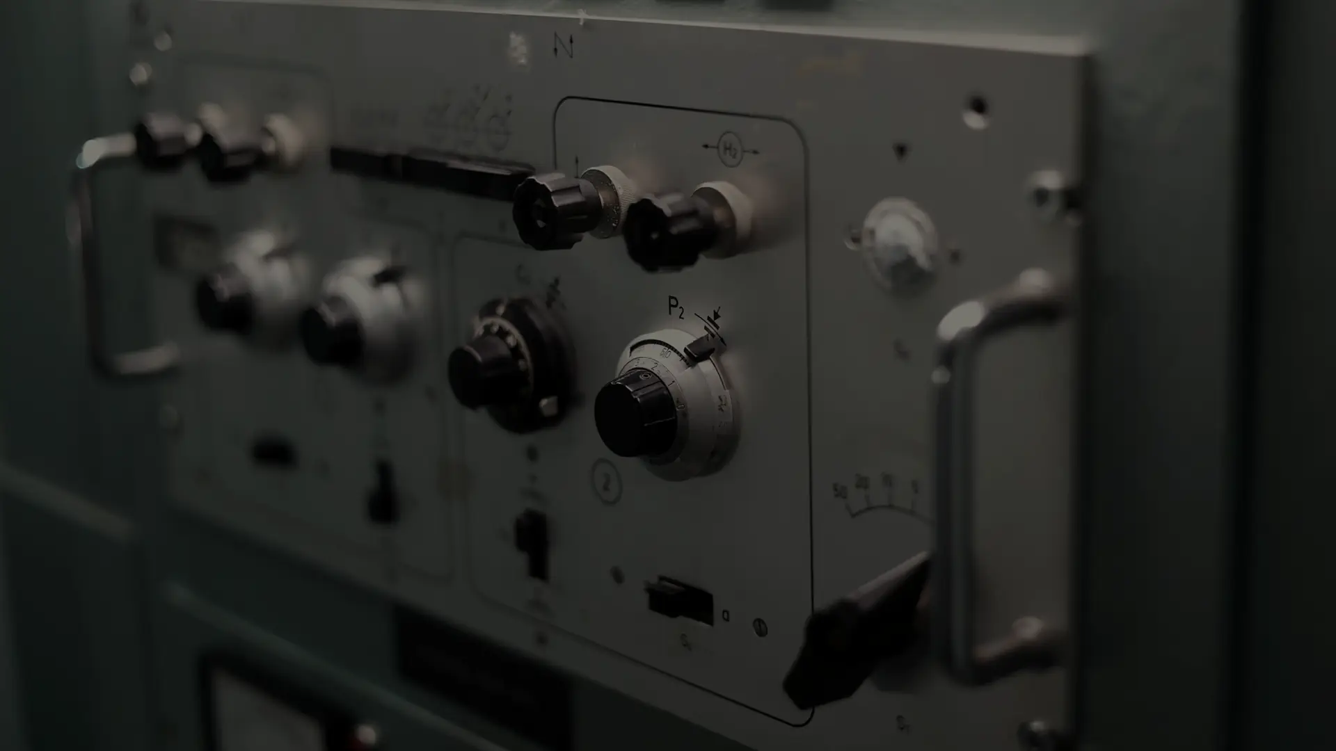 A control panel with pressure gauges and levers