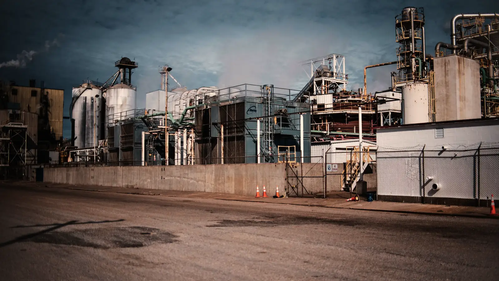 An industrial plant from outside, pipework and silos